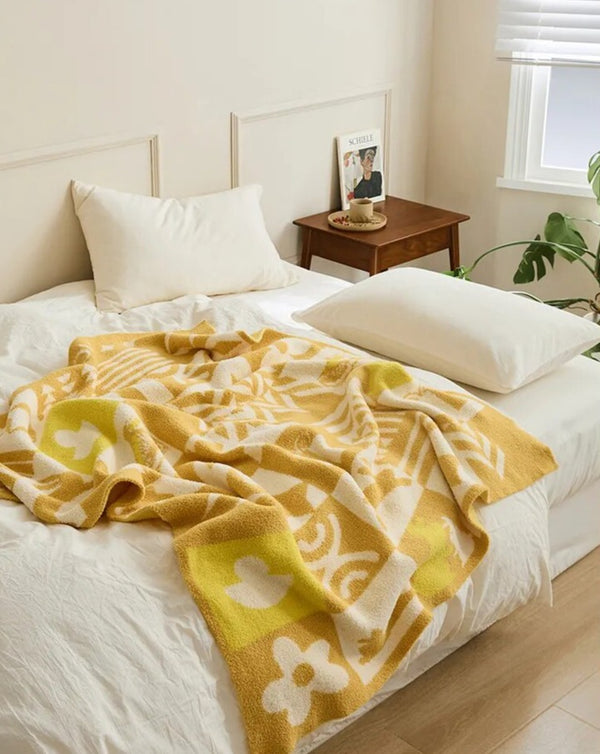 Gestrickte Überwurfdecke mit Urlaubsstimmung