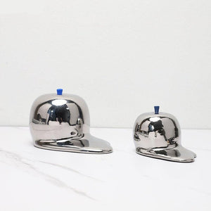 Escultura de manzana de cromo derretido