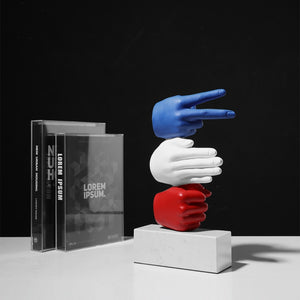 Escultura de diseño hecha a mano con soporte con peso en forma de piedra, papel o tijera