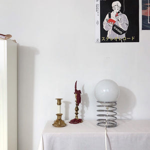 Lampe de table en verre avec base à ressort