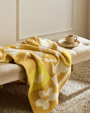 Gestrickte Überwurfdecke mit Urlaubsstimmung