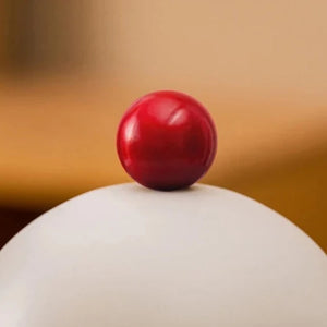 Chauffe-bougie moderne avec boule rouge