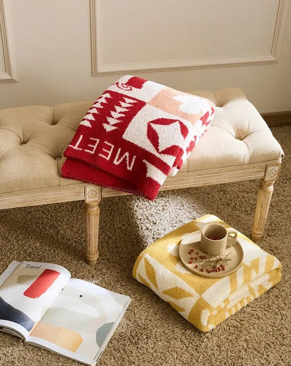 Gestrickte Überwurfdecke mit Urlaubsstimmung