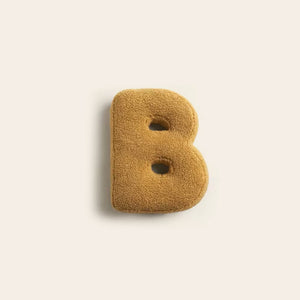 Sofakissen mit Alphabet-Motiv