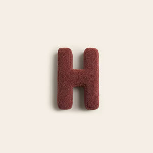 Sofakissen mit Alphabet-Motiv