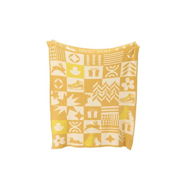 Gestrickte Überwurfdecke mit Urlaubsstimmung